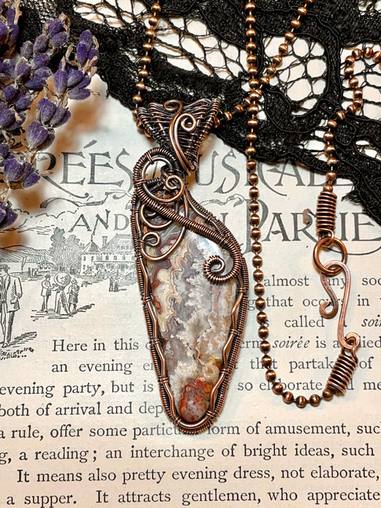 Crazy Lace Agate Pendant woven in Copper